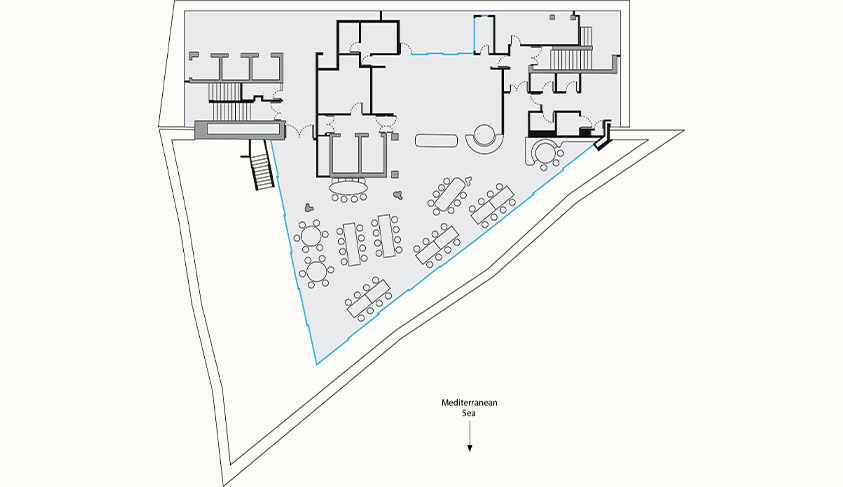 Floor plan of a Ceto featuring a dining area with multiple tables, adjacent rooms, and staircases, with an annotation indicating the Mediterranean Sea to the south.