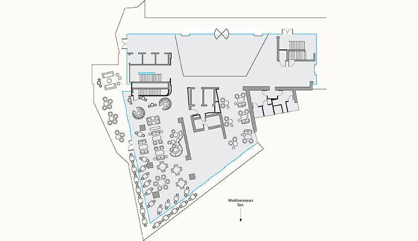 This floor plan illustrates the layout of Riviera Restaurant with seating arrangements, a bar area, and various facilities. The restaurant is situated along the Mediterranean Sea, offering views from the dining area.