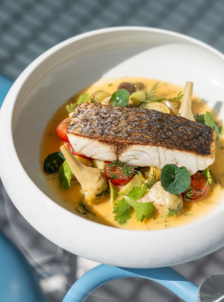 Seabass fillet with  Zucchini, mussels, fresh almond, spicy tomato broth