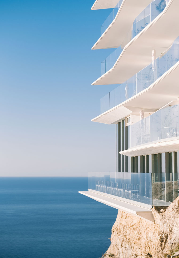 Maybourne Riviera Exterior, featuring a view of balconies and endless blue sea.